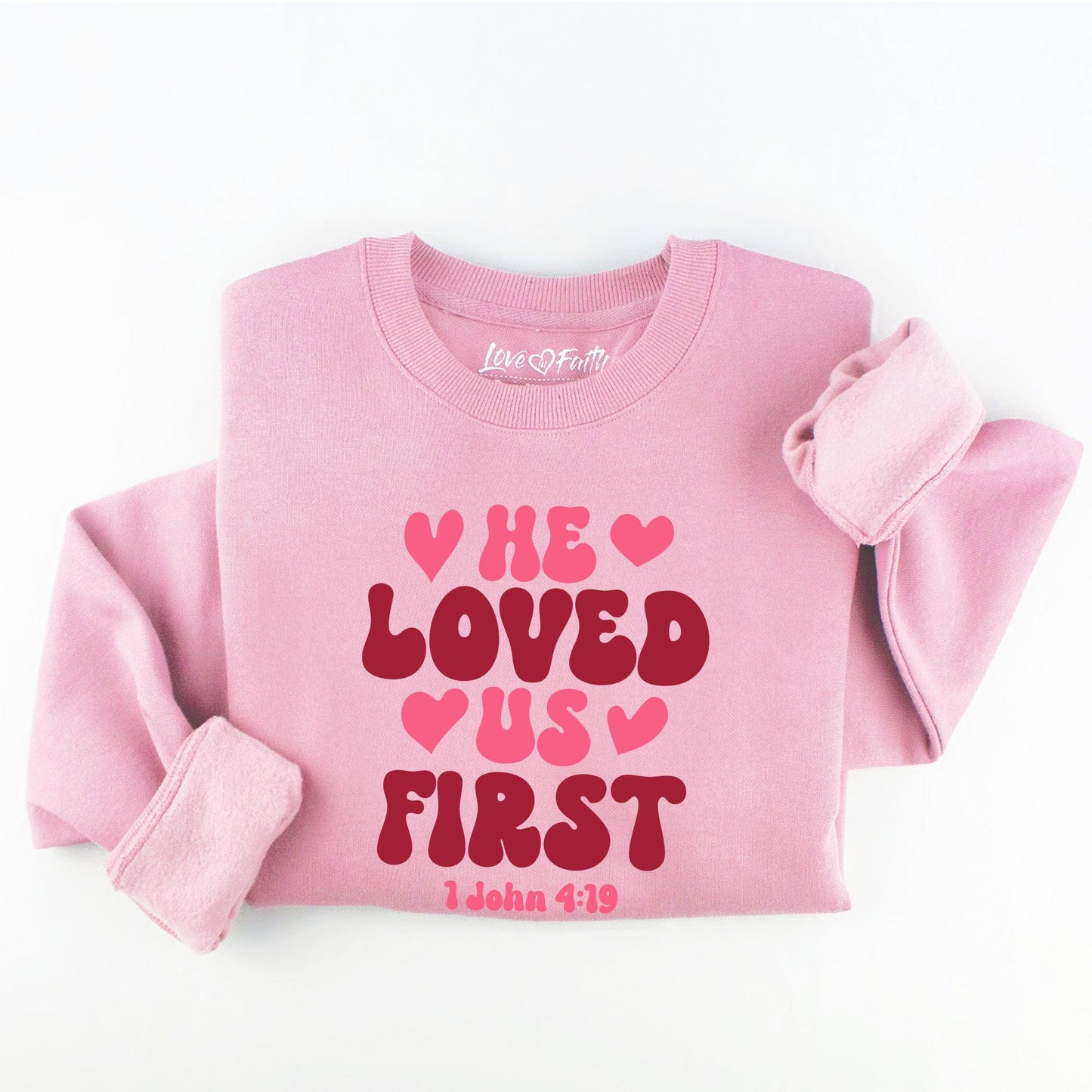 Embroidered He Loved Us First Sweatshirt